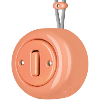 PORCELAIN ROUND SURFACE MOUNTED SLIM BUTTON SWITCH SALMON PINK - DYKE & DEAN